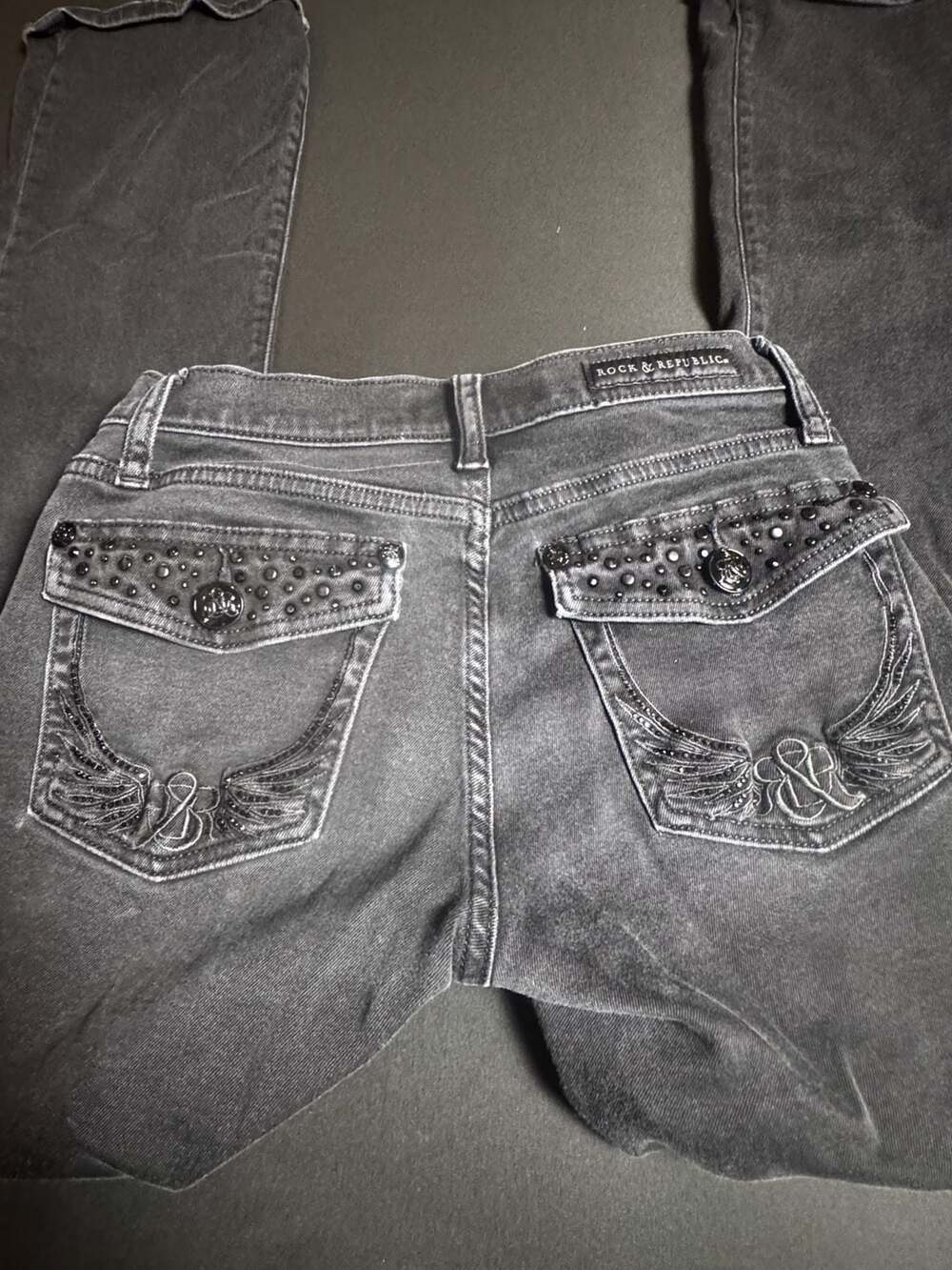 Rock & Republic Kasandra Black Flared Jeans with Embellished Wing Pockets